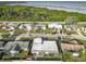 An aerial view shows the home's position relative to neighborhood streets and nearby waterfront at 3640 Richboro Dr, Holiday, FL 34691