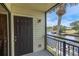 Private balcony with water view, iron railing, and room for seating near the main entry door at 432 Moorings Cove Dr. # 432, Tarpon Springs, FL 34689