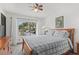 Bright bedroom with a large window offering plenty of natural light and outdoor views at 432 Moorings Cove Dr. # 432, Tarpon Springs, FL 34689