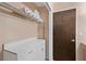 Walk-in closet with built-in storage, featuring a white countertop, storage cabinets, and shelves at 432 Moorings Cove Dr. # 432, Tarpon Springs, FL 34689