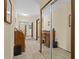 Hallway featuring a mirror and a view of other rooms at 432 Moorings Cove Dr. # 432, Tarpon Springs, FL 34689
