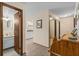 Hallway view leading to a bathroom and kitchen, with a small desk at 432 Moorings Cove Dr. # 432, Tarpon Springs, FL 34689