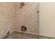 Close up of the shower featuring patterned neutral tile and a shower head at 432 Moorings Cove Dr. # 432, Tarpon Springs, FL 34689