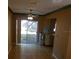 Dining room area with a sliding glass door leading to the backyard at 4451 Higate Rd, Spring Hill, FL 34609