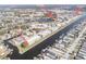 Aerial view of a waterfront condominium building with access to a community pool and waterways at 4452 Garnet Dr # 101, New Port Richey, FL 34652