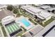 Condominium complex with a large swimming pool, shuffleboard, and parking at 4452 Garnet Dr # 101, New Port Richey, FL 34652