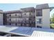 Condo featuring multiple stories, covered parking, and walkways to unit entrances at 4452 Garnet Dr # 101, New Port Richey, FL 34652