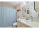 Bathroom with standard fixtures, including a sink, toilet, and shower at 6002 Laketree Ln # L, Temple Terrace, FL 33617