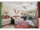Bedroom with convertible daybed, desk, and large windows at 6002 Laketree Ln # L, Temple Terrace, FL 33617