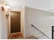 Warm entryway featuring a mushroom-themed rug and wood-paneled walls at 6002 Laketree Ln # L, Temple Terrace, FL 33617