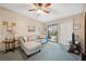 Comfortable living room with a plush couch and a sliding glass door leading to outdoor views at 6002 Laketree Ln # L, Temple Terrace, FL 33617