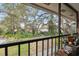Relaxing patio view of lush gardens and mature trees at 6002 Laketree Ln # L, Temple Terrace, FL 33617