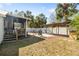 Large, fully fenced backyard with a covered patio at 6305 S Macdill Ave, Tampa, FL 33611