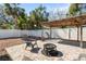 Backyard area with a brick patio, fire pit, and privacy fence at 6305 S Macdill Ave, Tampa, FL 33611