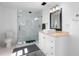 Modern bathroom featuring a glass shower, white vanity with square sink, and bright lighting at 6305 S Macdill Ave, Tampa, FL 33611