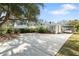 Charming single-story home with a spacious driveway and well-maintained landscaping at 6305 S Macdill Ave, Tampa, FL 33611