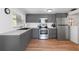 Modern kitchen featuring stainless steel appliances and gray cabinets at 6305 S Macdill Ave, Tampa, FL 33611