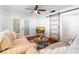 Comfortable living room featuring hardwood floors, glass doors, and a cozy couch at 6305 S Macdill Ave, Tampa, FL 33611