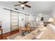 Spacious living room with hardwood floors, modern sliding doors, and a comfortable seating area at 6305 S Macdill Ave, Tampa, FL 33611