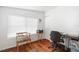 Clean office with wood floors, functional furniture, and natural light at 6305 S Macdill Ave, Tampa, FL 33611
