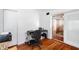 Home office featuring hardwood floors and a view to living room and sliding doors at 6305 S Macdill Ave, Tampa, FL 33611