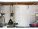 Interior view of the shed with brooms and gardening tools on a peg board at 6305 S Macdill Ave, Tampa, FL 33611