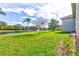 Backyard with lake view and palm trees at 6734 Dali Ave # 205, Land O Lakes, FL 34637