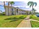 Beautiful exterior shot of a two-story home with a well-manicured lawn and a sidewalk at 6734 Dali Ave # 205, Land O Lakes, FL 34637