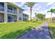 Well-maintained condo community featuring manicured lawns, walking path, and screened patios on both levels at 6734 Dali Ave # 205, Land O Lakes, FL 34637