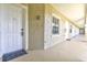 Exterior hallway to front door and window at 6734 Dali Ave # 205, Land O Lakes, FL 34637