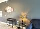 Sitting area with side table and lamp at 6734 Dali Ave # 205, Land O Lakes, FL 34637