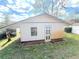 A small shed with white siding and blue trim provides storage for your outdoor projects and tools at 7090 Red Oak Loop, New Port Richey, FL 34654