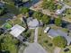 Aerial view of a waterfront property with a pool and a long driveway at 7235 Maryland Ave, Hudson, FL 34667