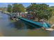 Aerial shot of the waterfront property, featuring the house with boat docks, decks, and canal access at 7235 Maryland Ave, Hudson, FL 34667