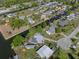 Aerial view showcasing the waterfront homes along the canal, complete with docks and beautiful surroundings at 7235 Maryland Ave, Hudson, FL 34667
