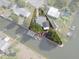 Aerial view of a waterfront property highlighting the property lines and proximity to the canal at 7235 Maryland Ave, Hudson, FL 34667