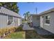 A home's outdoor space featuring a shed, greenery and walkway, enhancing the property's appeal at 7235 Maryland Ave, Hudson, FL 34667