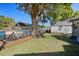 Waterfront home featuring a well-manicured backyard with a private dock and boat lift at 7235 Maryland Ave, Hudson, FL 34667