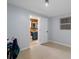 Bedroom boasting neutral walls and tile floor with a closet and view into an ensuite bathroom at 7235 Maryland Ave, Hudson, FL 34667
