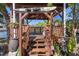 Inviting backyard deck with stairs, offering a perfect blend of nature and leisure space at 7235 Maryland Ave, Hudson, FL 34667