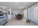 Open-concept dining area featuring a table with seating for four, tile flooring, and natural light at 7235 Maryland Ave, Hudson, FL 34667