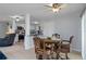 Inviting dining area with a round table, seating for four, and open access to the kitchen area at 7235 Maryland Ave, Hudson, FL 34667