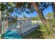Private dock on a canal with seating area, perfect for relaxation and enjoying waterfront views at 7235 Maryland Ave, Hudson, FL 34667