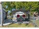 Covered parking spot for jet skis and equipment and a well kept yard and driveway at 7235 Maryland Ave, Hudson, FL 34667