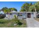 Charming single-story home with a well-manicured lawn and inviting front porch at 7235 Maryland Ave, Hudson, FL 34667