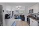 Kitchen with a stainless oven, microwave, and view into the living room and dining room at 7235 Maryland Ave, Hudson, FL 34667