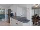 Kitchen bar with stunning blue granite countertops and views into the dining room at 7235 Maryland Ave, Hudson, FL 34667