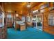 Relaxing primary bedroom with an ornate four-poster bed, lots of light and a sliding door to the Sun Room at 7235 Maryland Ave, Hudson, FL 34667