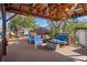 Outdoor deck with comfortable seating and a gazebo, ideal for relaxation and social gatherings at 7235 Maryland Ave, Hudson, FL 34667