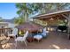 Elevated outdoor deck with a covered gazebo, outdoor kitchen and ample seating at 7235 Maryland Ave, Hudson, FL 34667